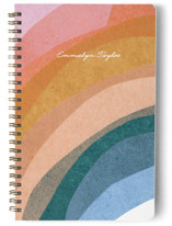 This is a orange journal by Carrie Moradi called rainbow collage with standard printing on premium cover stock in notebook.